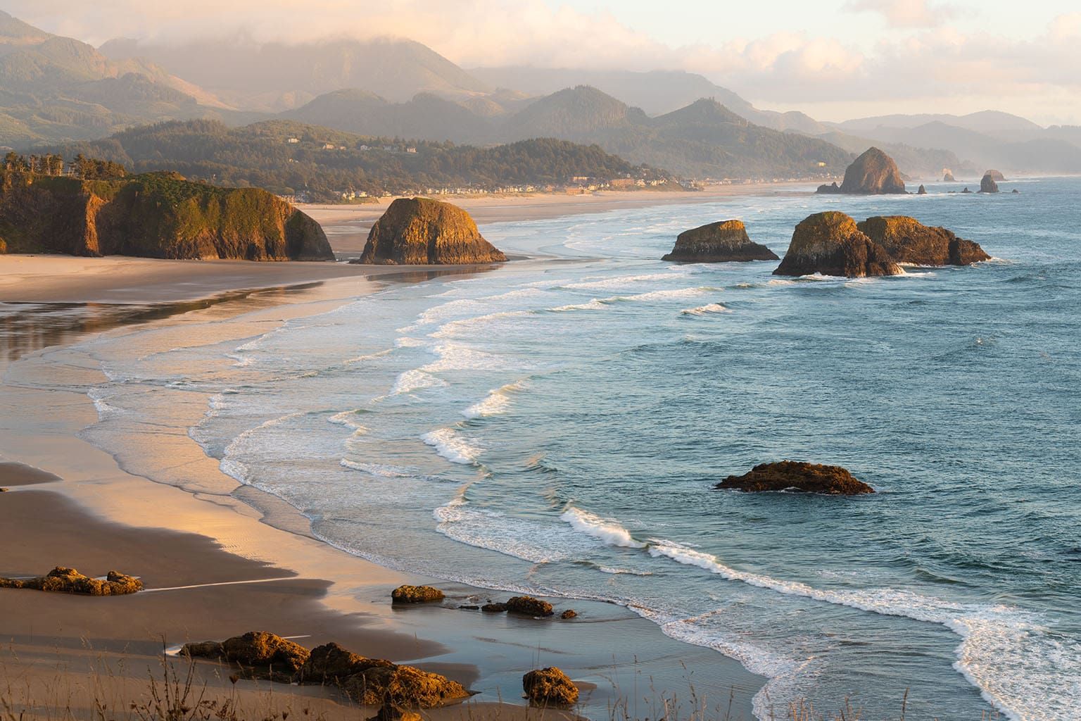 Late evening light illuminates Cannon Beach Oregon